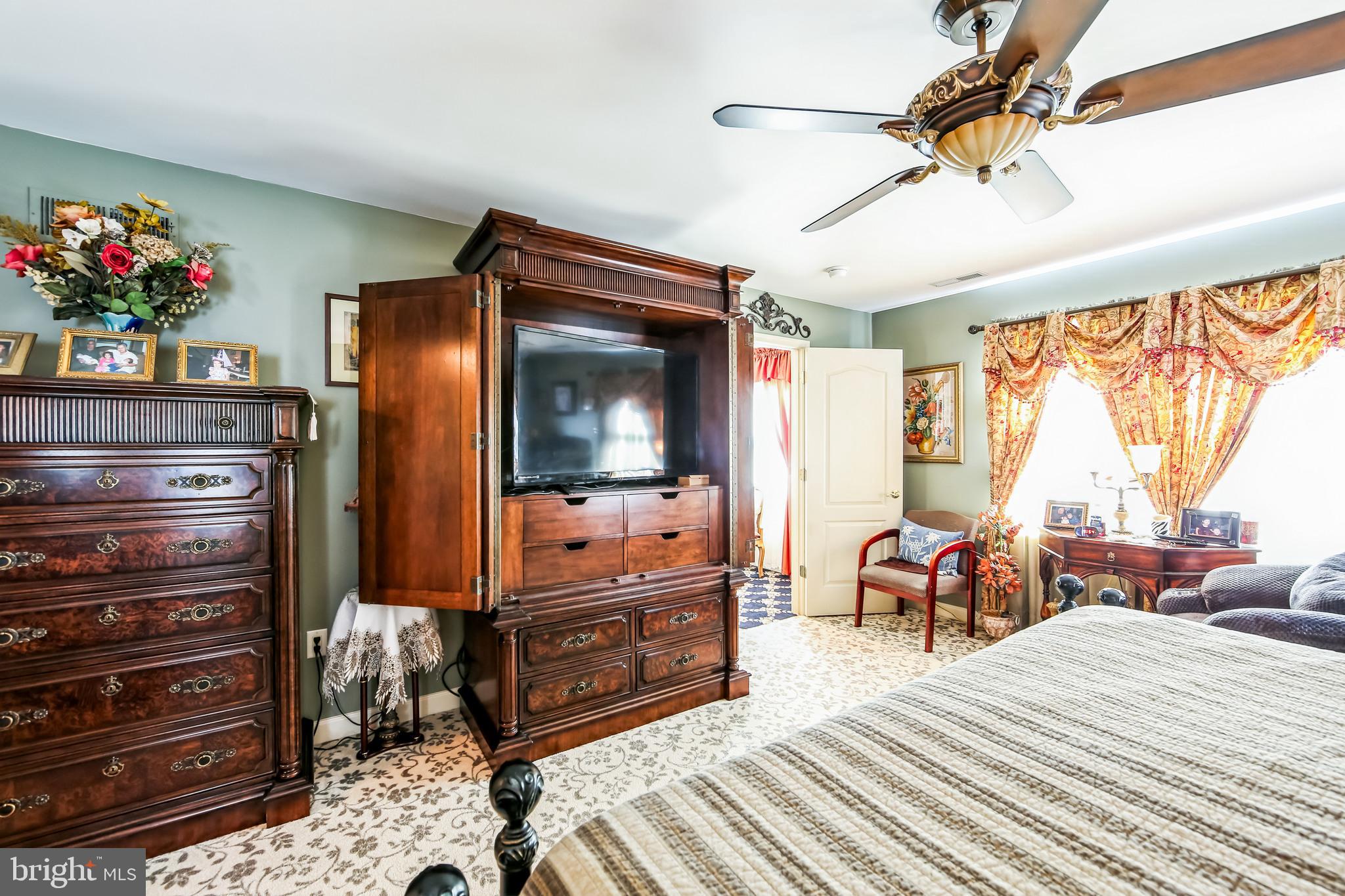 1096 Dexter Corner Road Townsend, DE 19734 - Photo 22 of 67 a bedroom with furniture and a flat screen tv