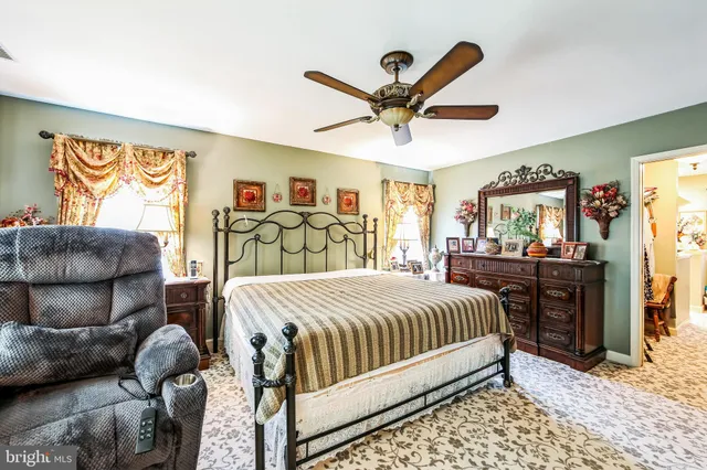 a living room with furniture a couch and a window