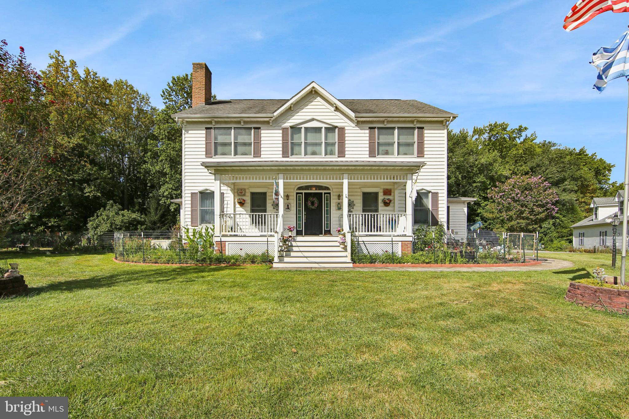 1096 Dexter Corner Road Townsend, DE 19734 - Photo 3 of 67 a front view of a house with a garden