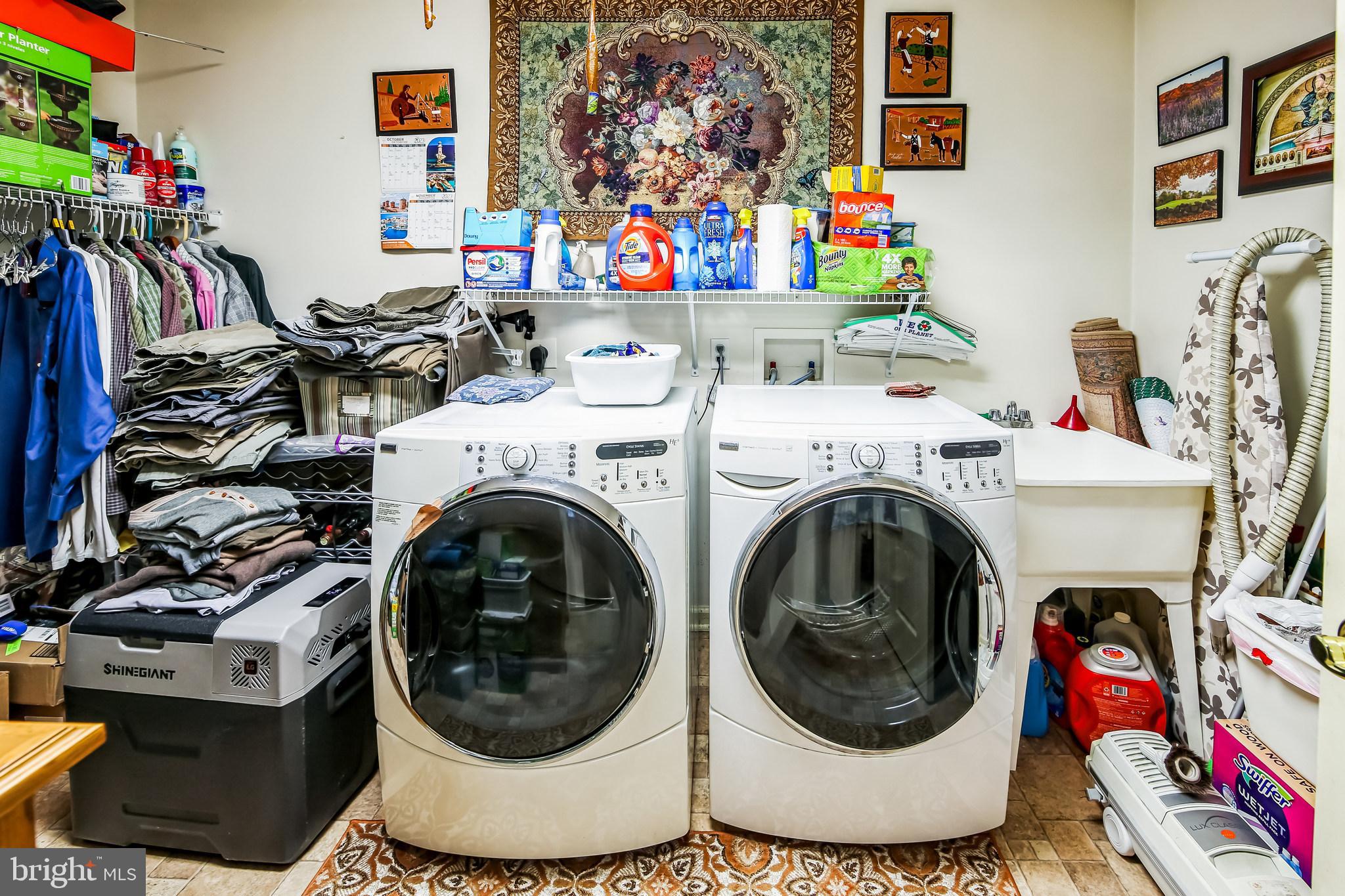 1096 Dexter Corner Road Townsend, DE 19734 - Photo 38 of 67 a utility room with dryer washer and a view of kitchen
