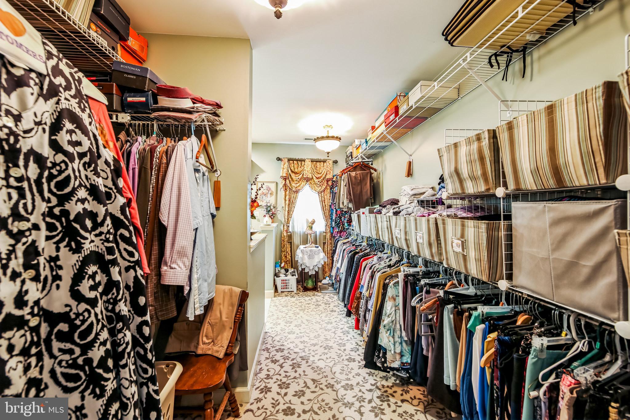 1096 Dexter Corner Road Townsend, DE 19734 - Photo 39 of 67 a view of walk in closet with clothes and shoes