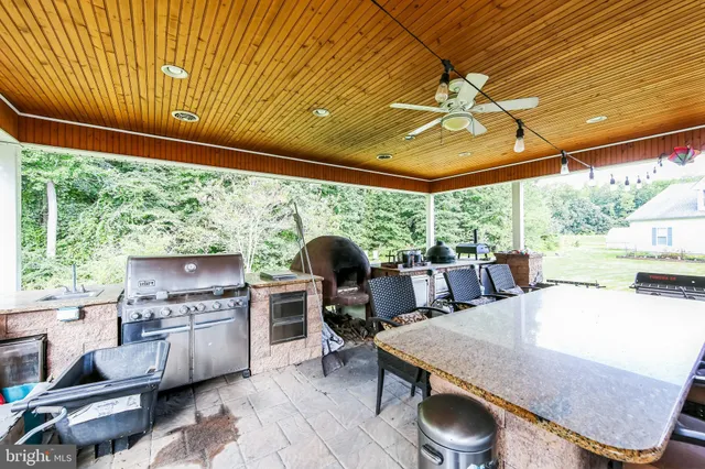 a view of a house with wooden fence