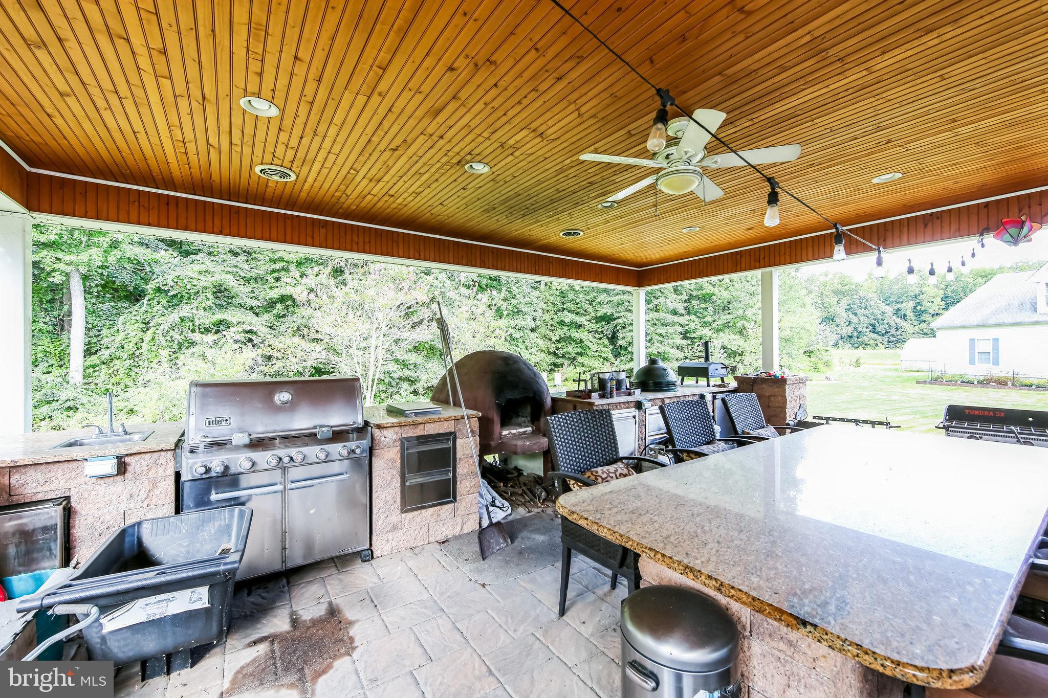 1096 Dexter Corner Road Townsend, DE 19734 - Photo 41 of 67 a dining room with a table chairs and a floor to ceiling window