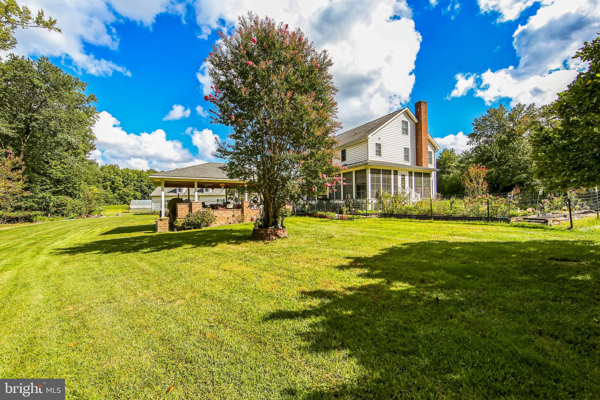 1096 Dexter Corner Road Townsend, DE 19734 - Photo 44 of 67 a front view of a house with a big yard