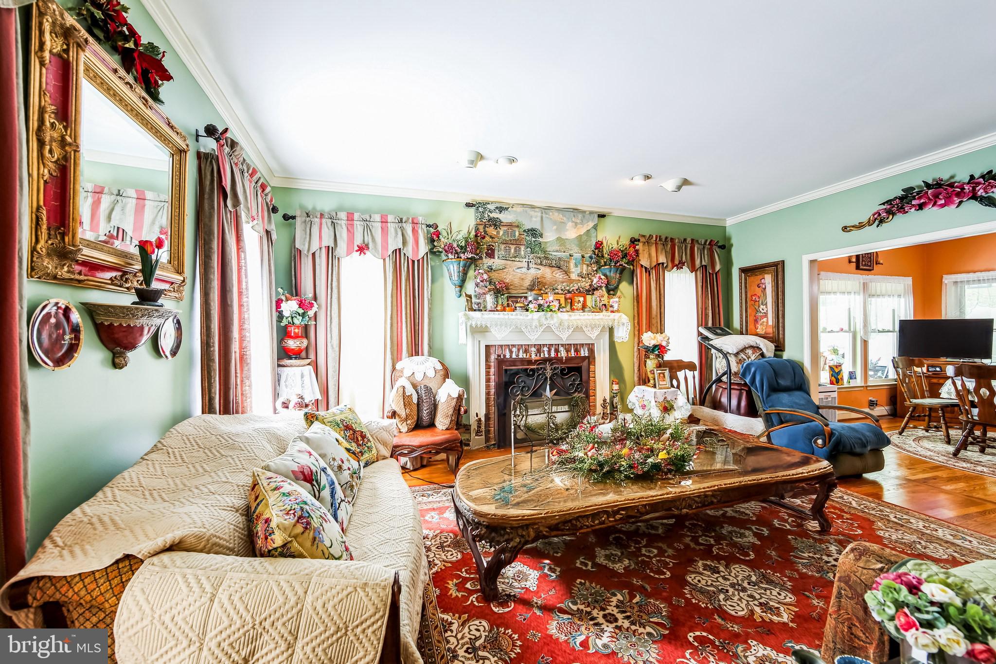 1096 Dexter Corner Road Townsend, DE 19734 - Photo 7 of 67 a living room with furniture fireplace and a large window