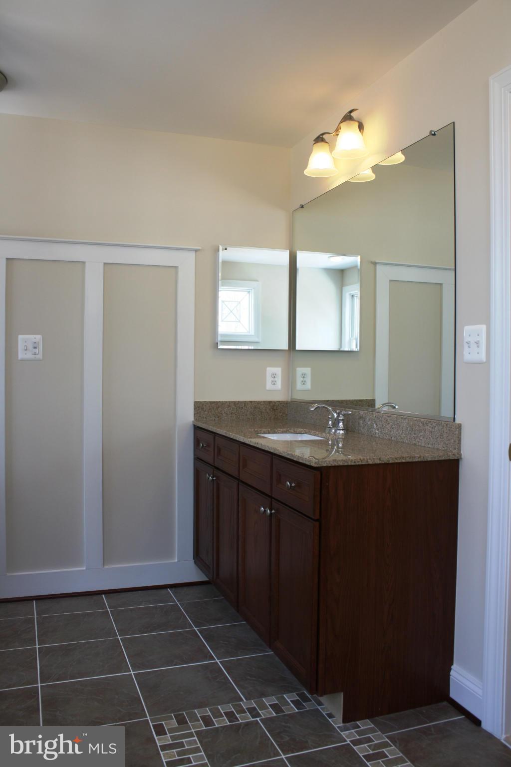 1735 Laurel Brook Road Fallston, MD 21047 - Photo 11 of 20 a bathroom with a granite countertop sink and a mirror