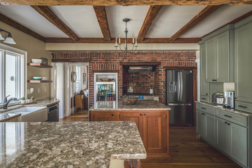 143 Haverhill Road Amesbury, MA 01913 - Photo 7 of 38 a kitchen with counter top space and stainless steel appliances