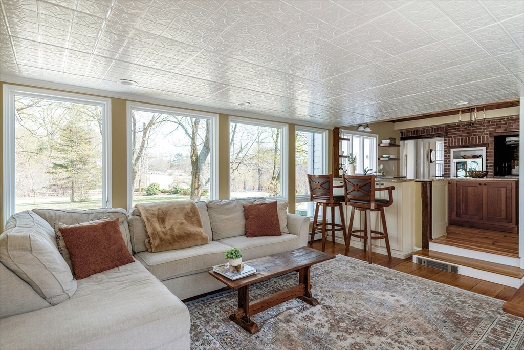 143 Haverhill Road Amesbury, MA 01913 - Photo 8 of 38 a living room with furniture and a large window