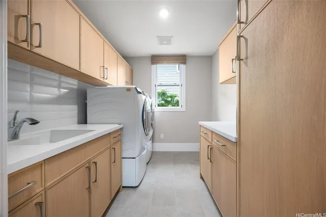 a kitchen with a sink a refrigerator and window