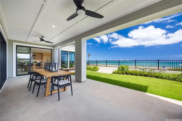 a view of a patio with a yard