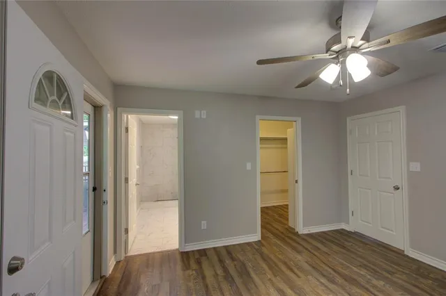 wooden floor in an empty room with a mirror