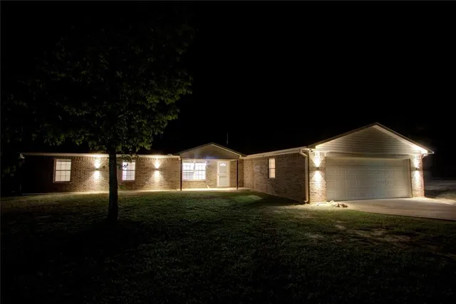 a front view of a house with yard
