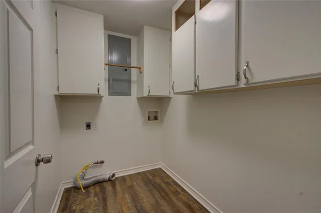 a view of storage and utility room with closet