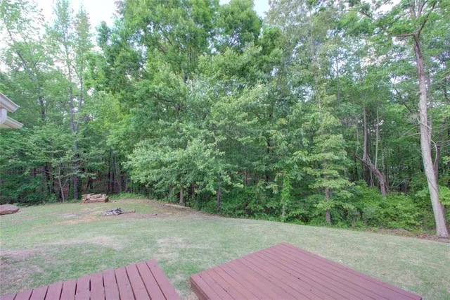 a view of a backyard with a wooden floor