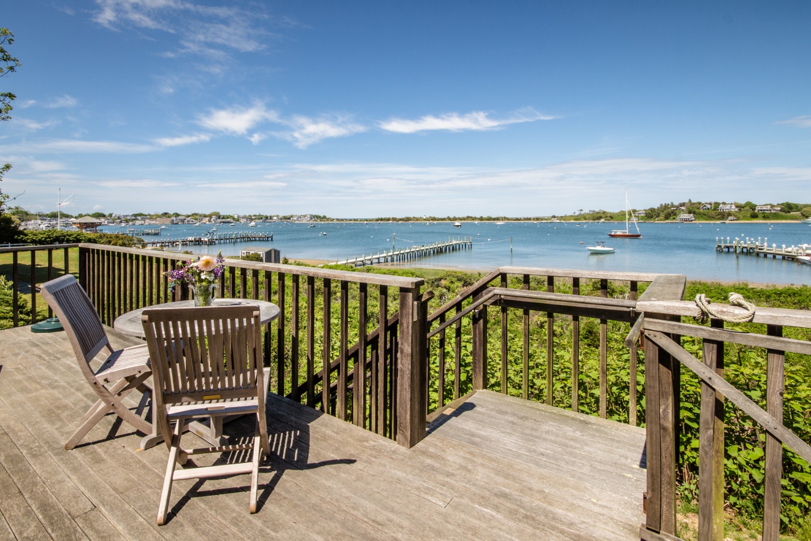 191 Katama Road Edgartown, MA 02539 - Photo 13 of 20 a view of a balcony with wooden floor and outdoor seating