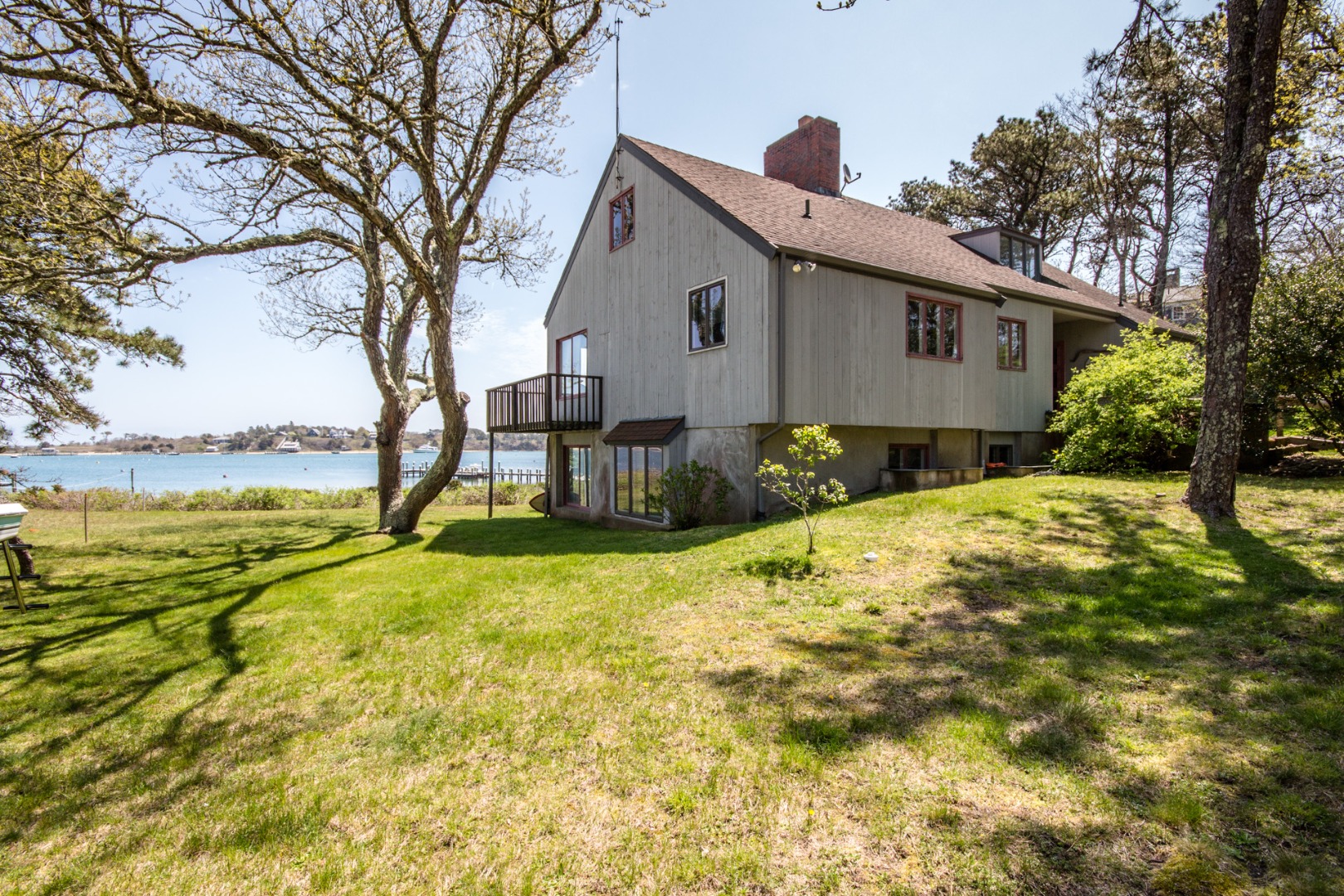 191 Katama Road Edgartown, MA 02539 - Photo 14 of 20 a front view of house with yard and trees around