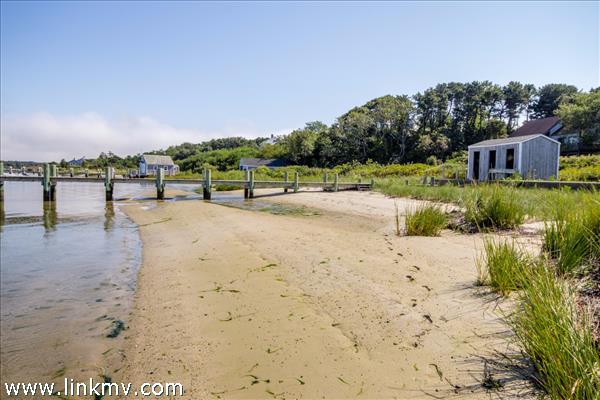 191 Katama Road Edgartown, MA 02539 - Photo 7 of 20 a view of a beach with a yard