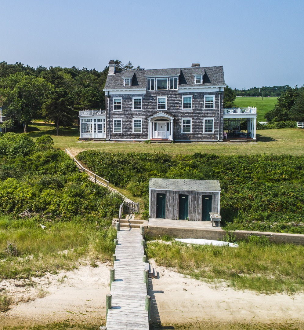 191 Katama Road Edgartown, MA 02539 - Photo 9 of 20 a house with river in front of it