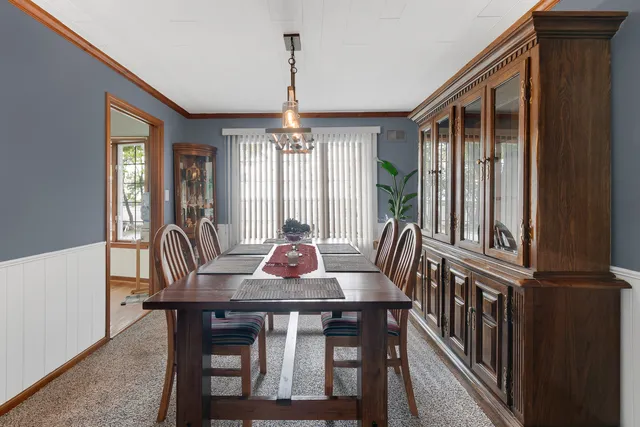 a view of a dining room with furniture window and outside view