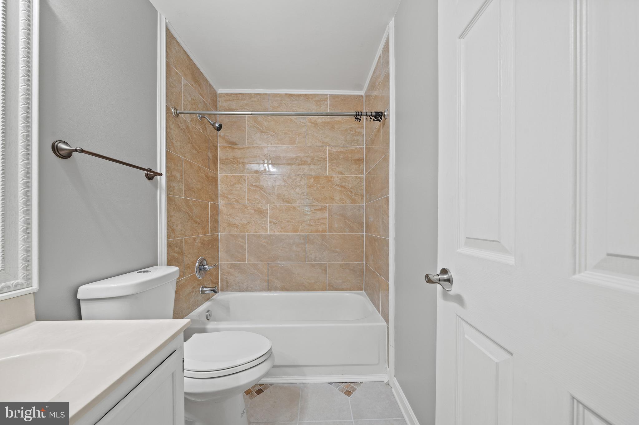 1132 Ingate Road, Unit 1132 Baltimore, MD 21227 - Photo 15 of 35 a bathroom with a toilet and a shower