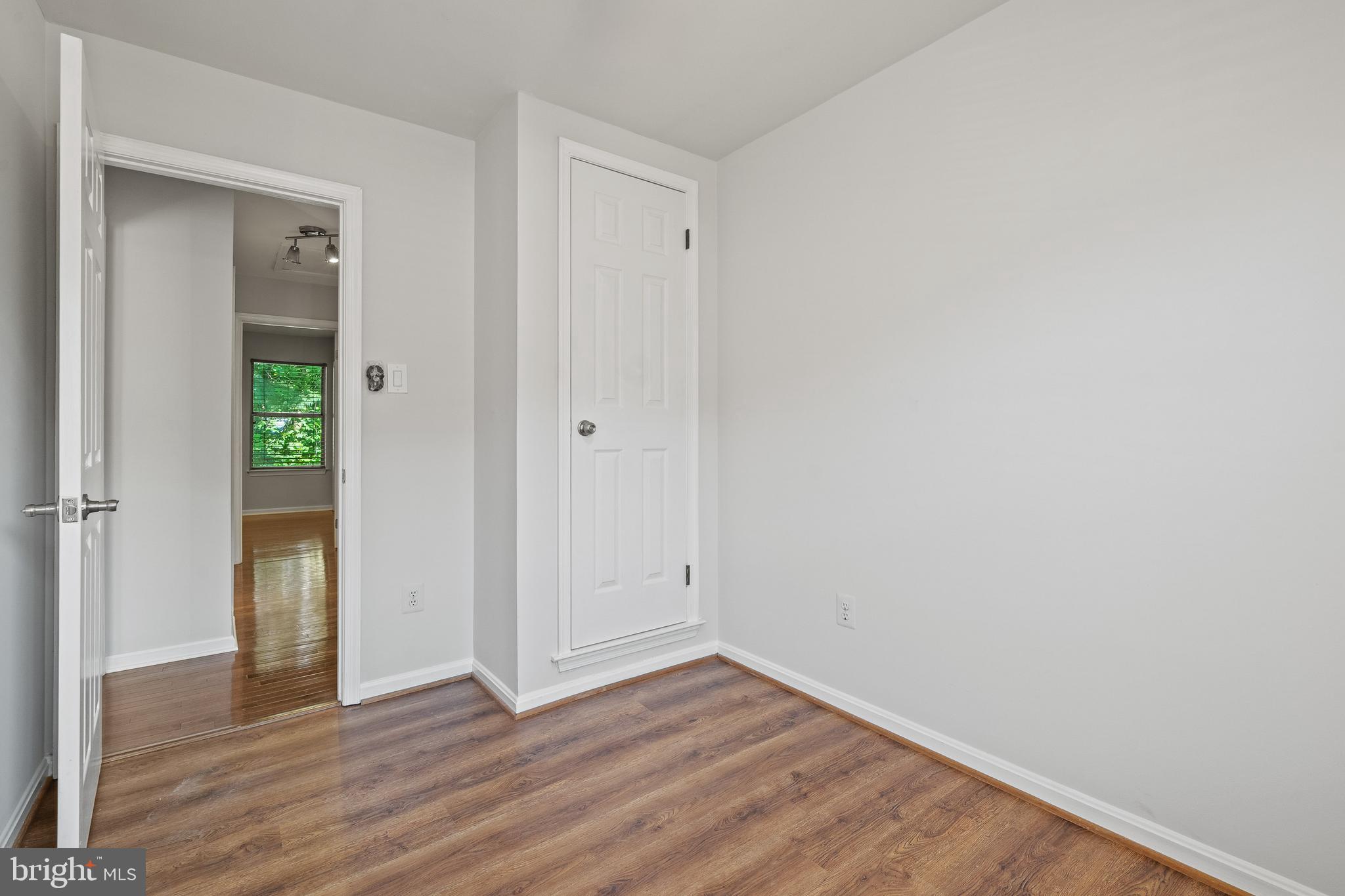 1132 Ingate Road, Unit 1132 Baltimore, MD 21227 - Photo 17 of 35 a view of an empty room with wooden floor