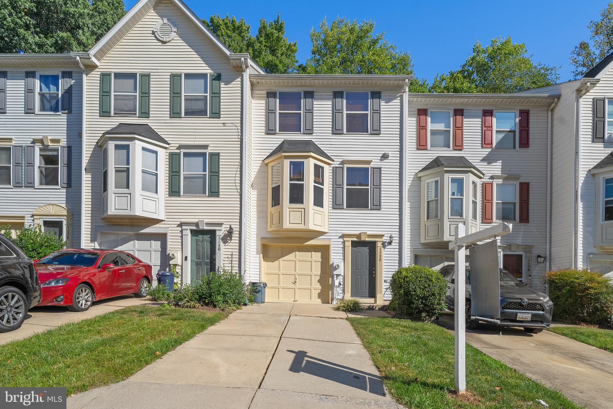 1132 Ingate Road, Unit 1132 Baltimore, MD 21227 - Photo 30 of 35 a front view of a house with a yard
