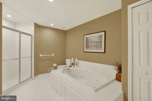 a en suite bathroom with a sink and mirror