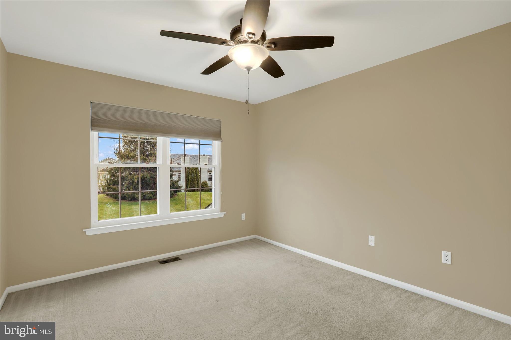 102 Julian Drive East, Unit E Warminster, PA 18974 - Photo 19 of 28 a view of an empty room with a window