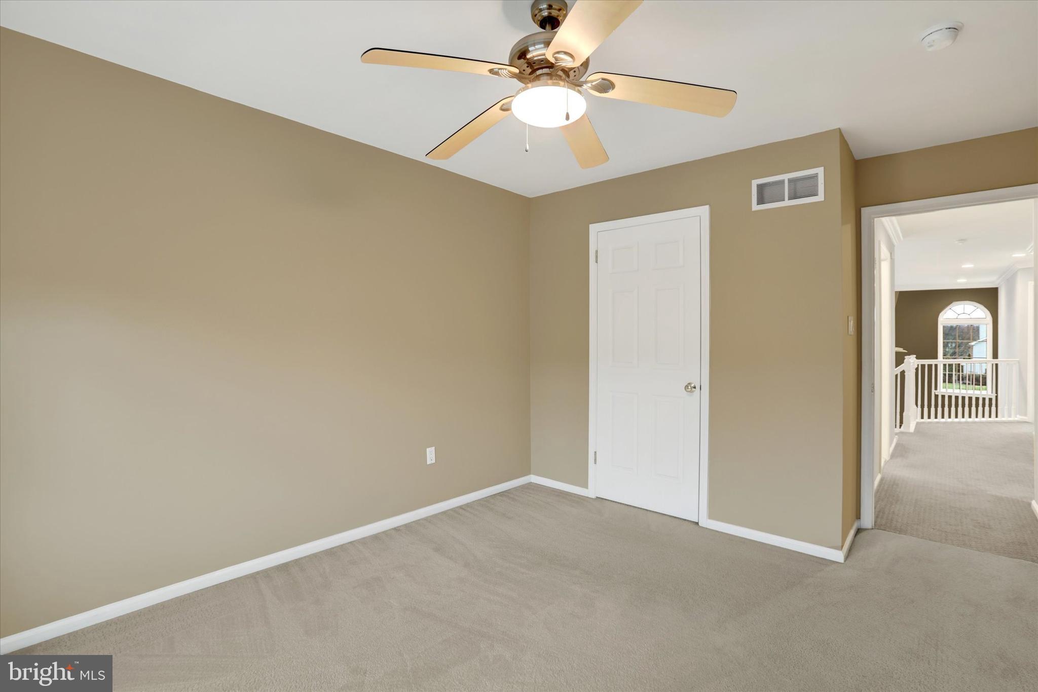 102 Julian Drive East, Unit E Warminster, PA 18974 - Photo 22 of 28 an empty room with fan and a ceiling fan