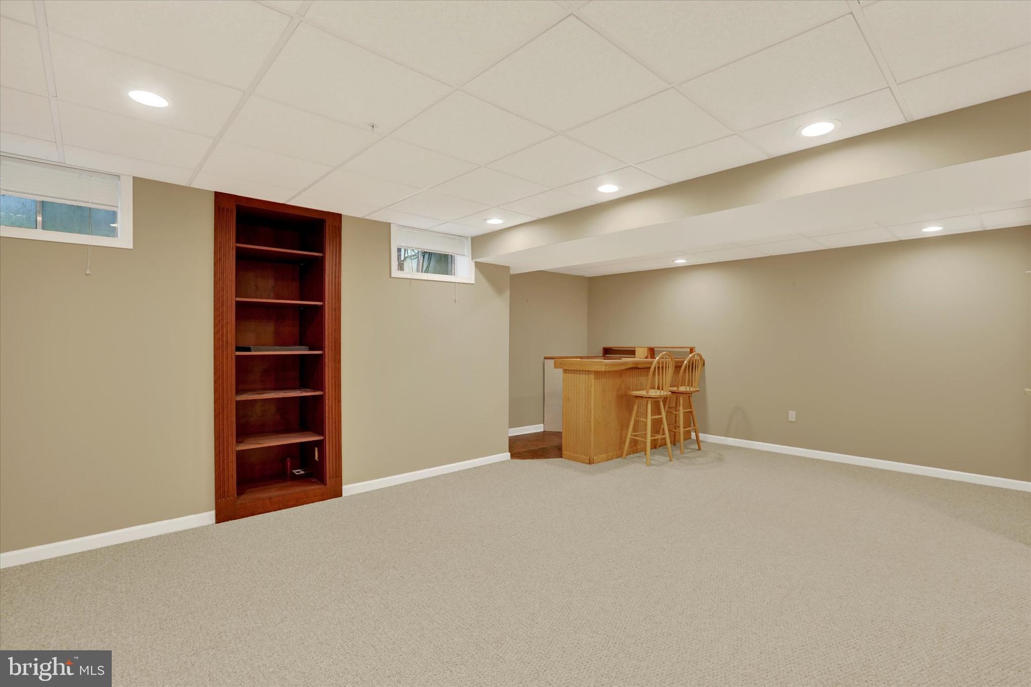 102 Julian Drive East, Unit E Warminster, PA 18974 - Photo 25 of 28 a view of an empty room with cabinet and a window