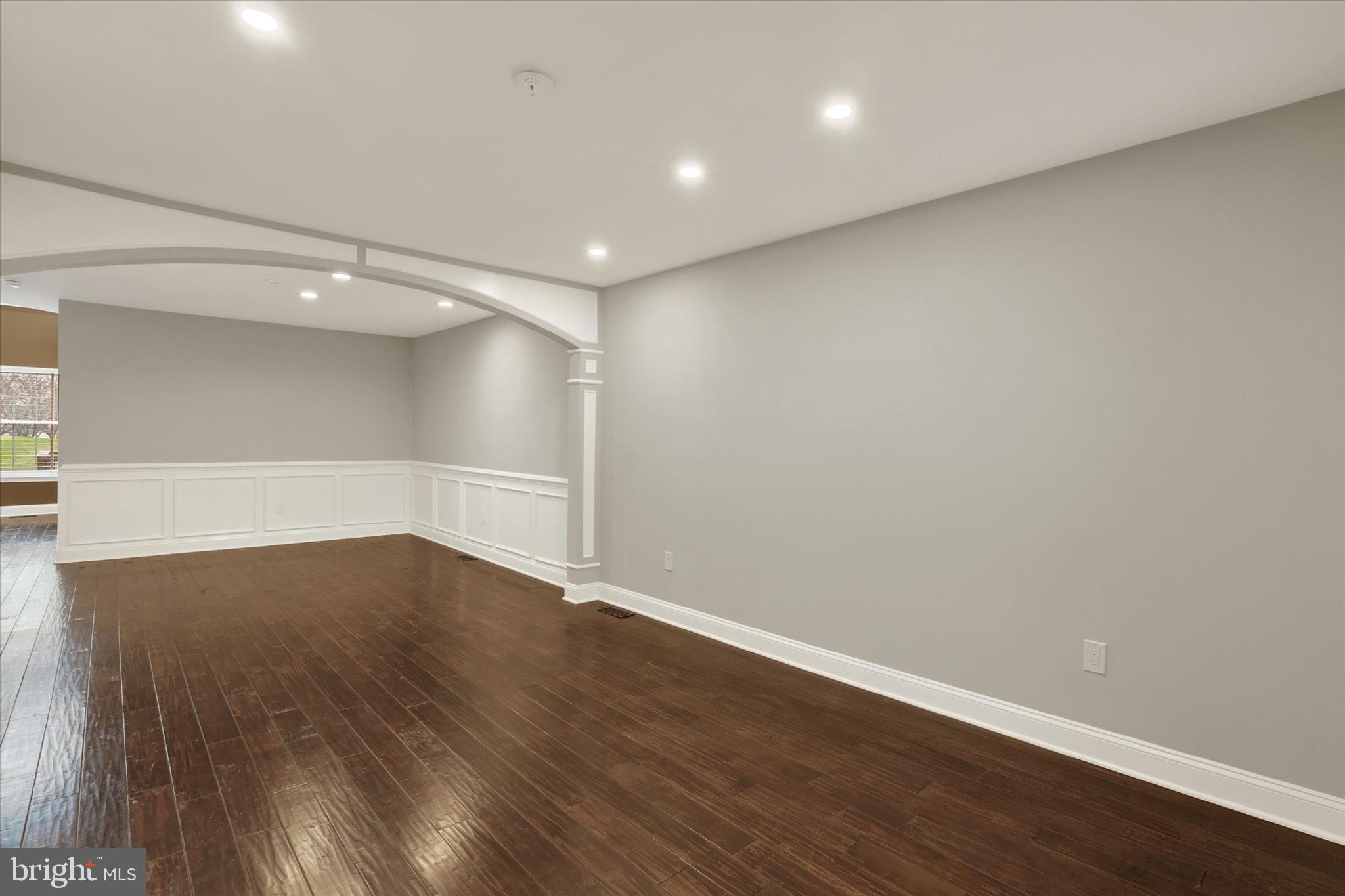 102 Julian Drive East, Unit E Warminster, PA 18974 - Photo 3 of 28 a view of an empty room with wooden floor