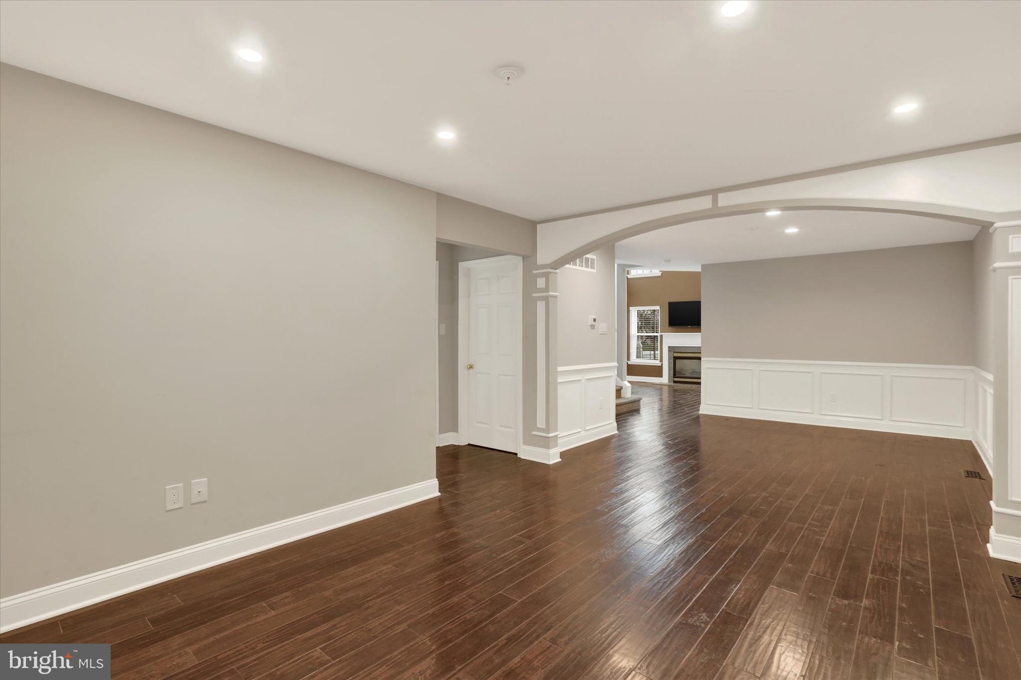 102 Julian Drive East, Unit E Warminster, PA 18974 - Photo 5 of 28 a view of a big room with wooden floor and a kitchen