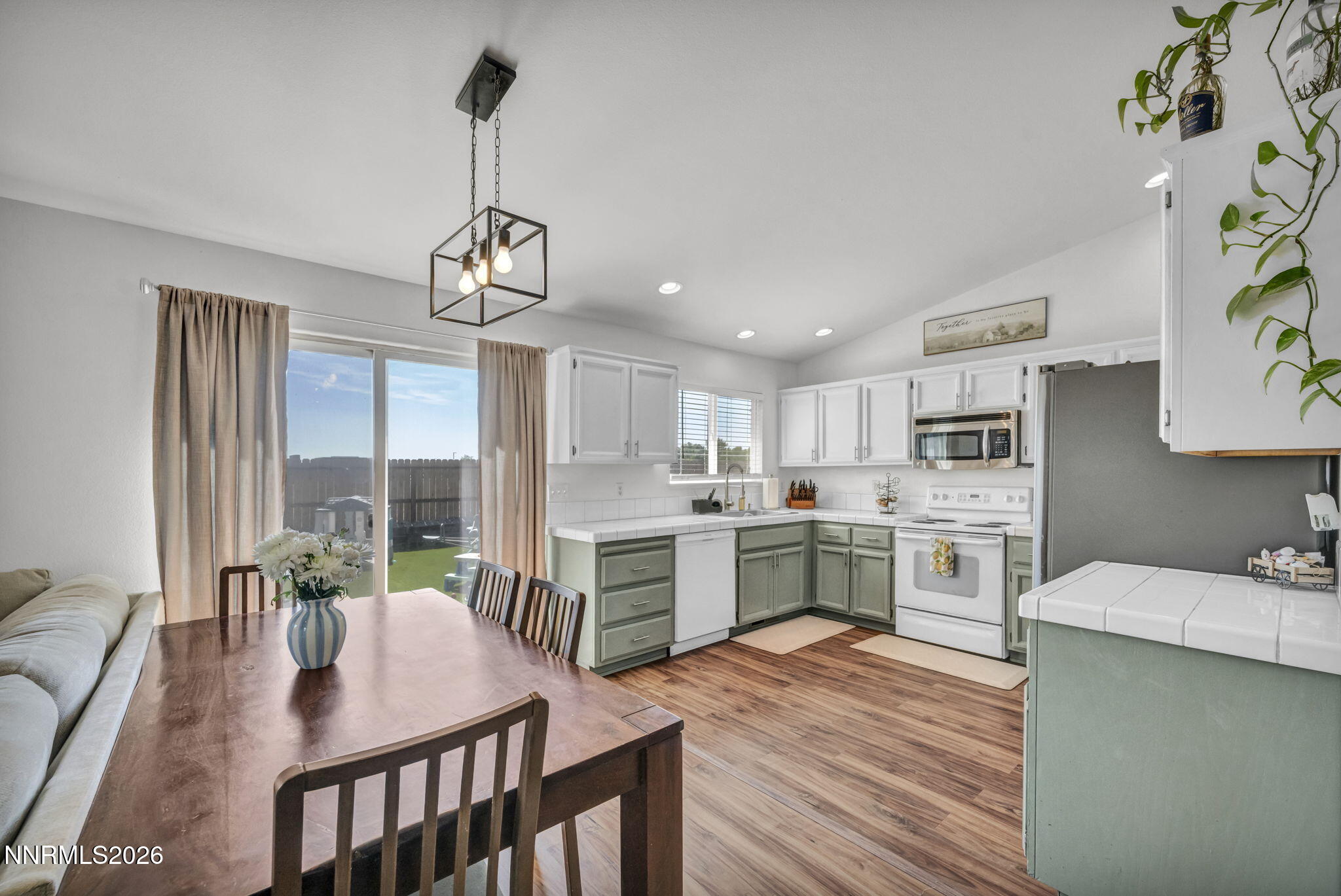 111 Relief Springs Road Fernley, NV 89408 - Photo 12 of 30 a kitchen with white cabinets and stainless steel appliances