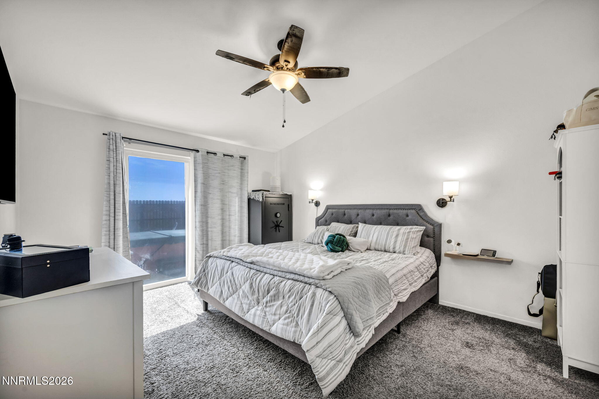 111 Relief Springs Road Fernley, NV 89408 - Photo 15 of 30 a bedroom with a bed and a chandelier