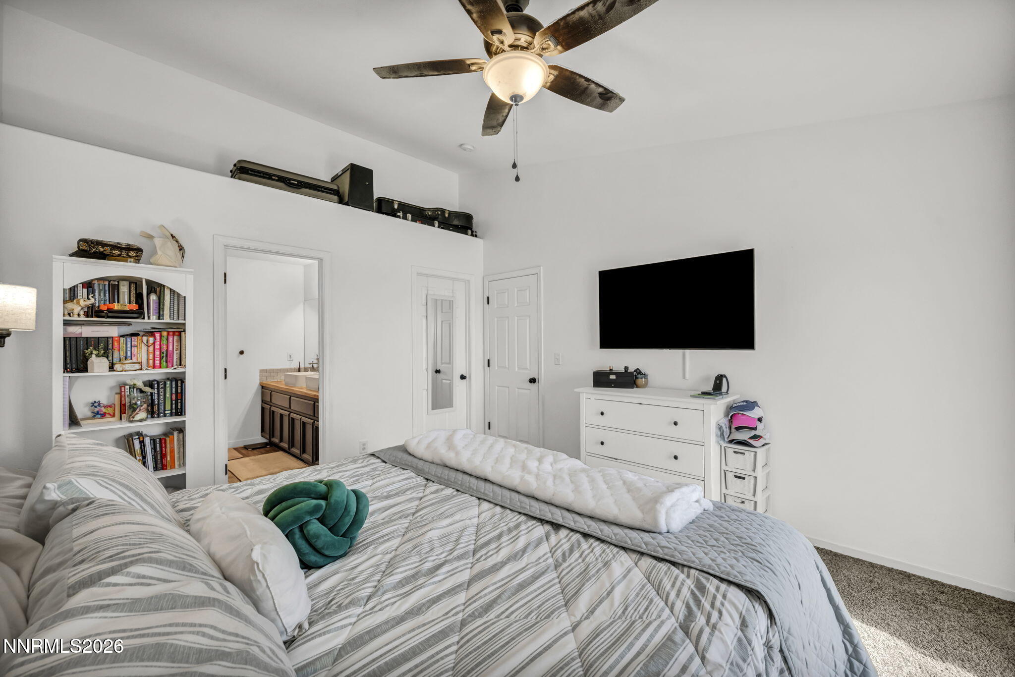111 Relief Springs Road Fernley, NV 89408 - Photo 16 of 30 a bedroom with a bed and a flat screen tv