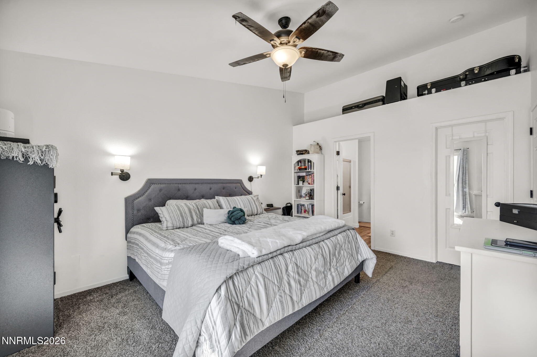 111 Relief Springs Road Fernley, NV 89408 - Photo 17 of 30 a bedroom with a bed and a ceiling fan