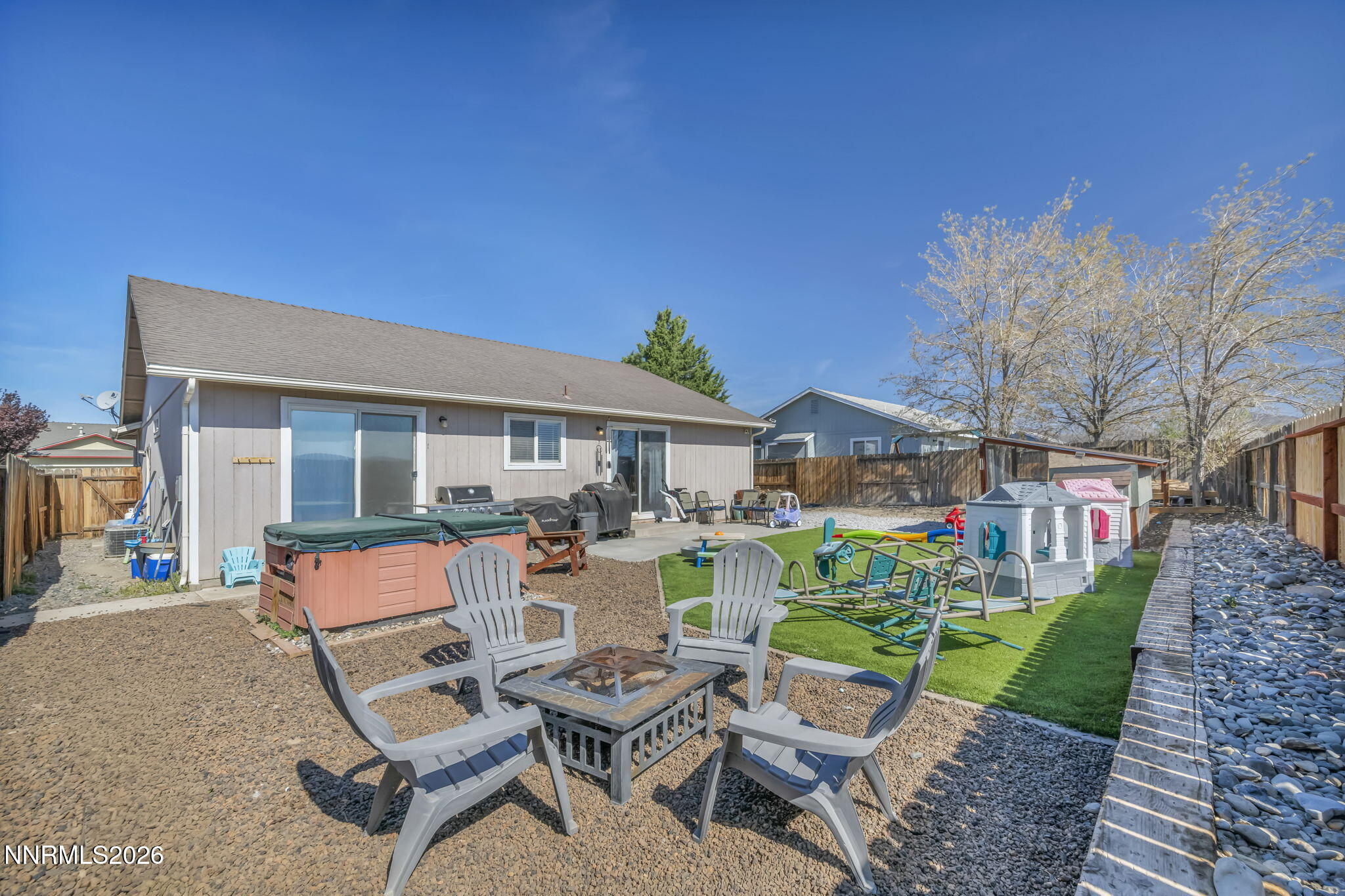 111 Relief Springs Road Fernley, NV 89408 - Photo 28 of 30 a view of a chairs and table in a backyard