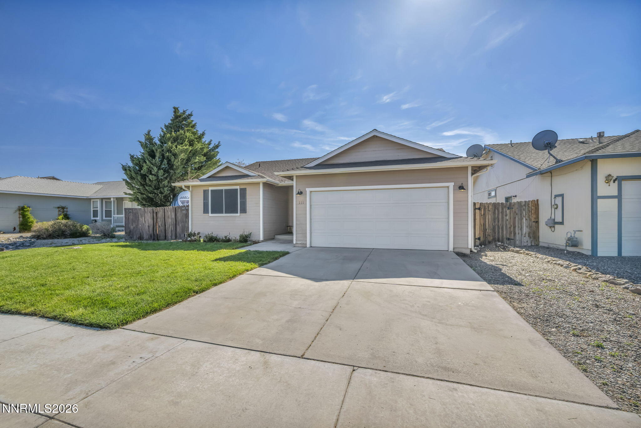 111 Relief Springs Road Fernley, NV 89408 - Photo 3 of 30 a front view of a house with a yard and garage