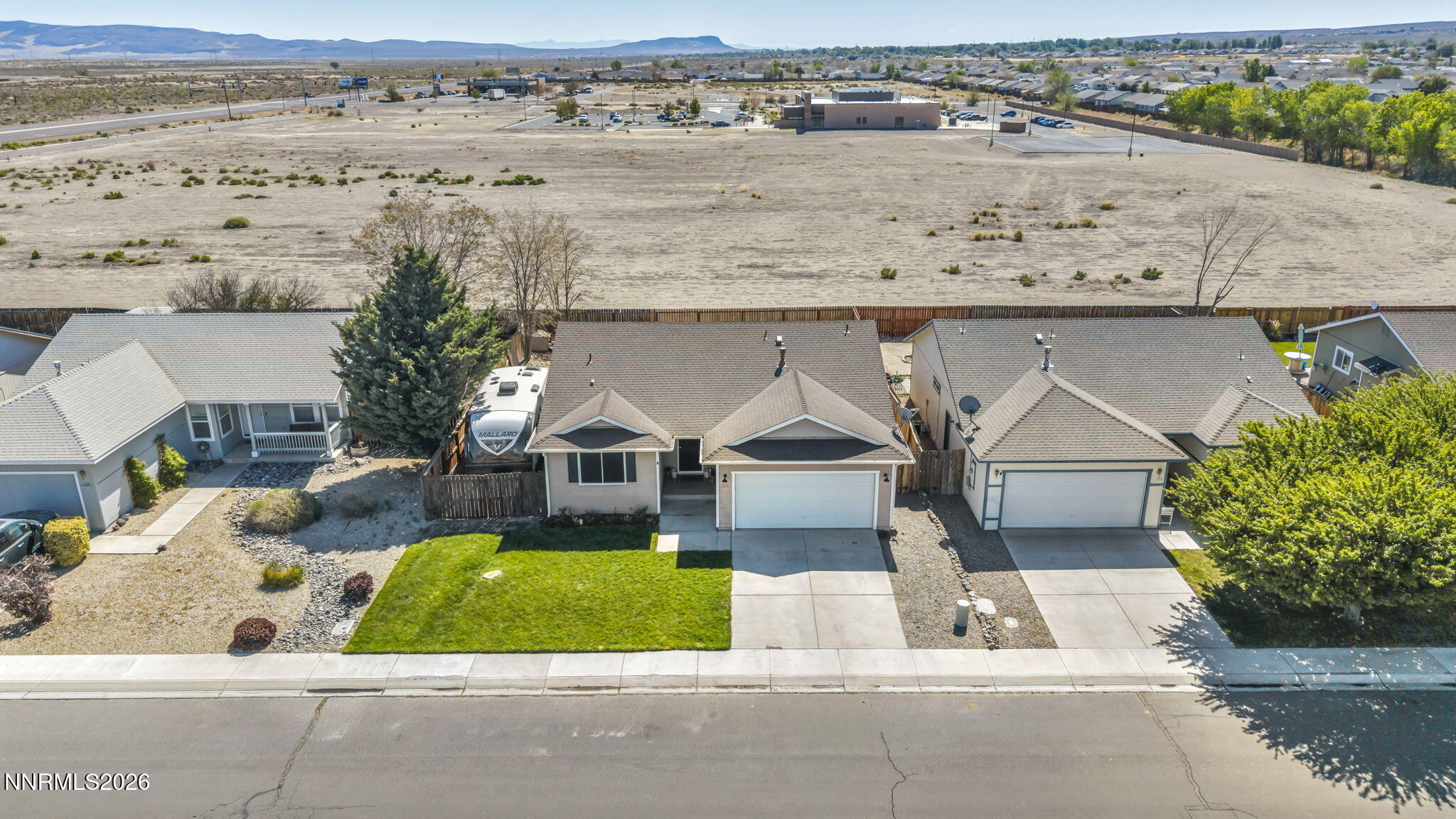 111 Relief Springs Road Fernley, NV 89408 - Photo 4 of 30 an aerial view of a house with a yard wooden table and chairs