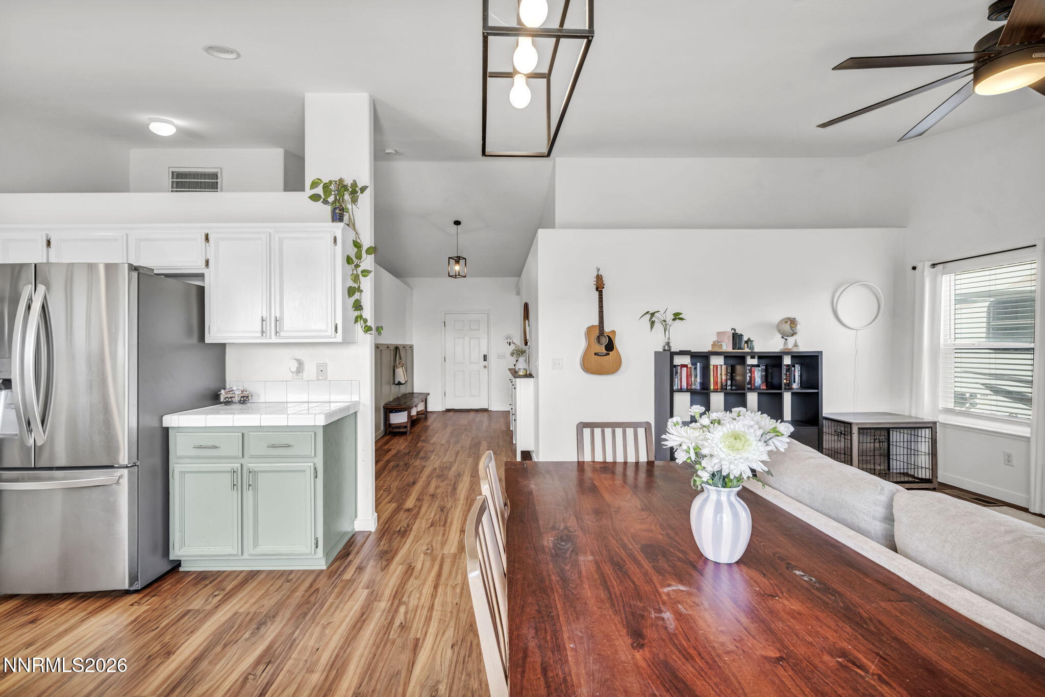 111 Relief Springs Road Fernley, NV 89408 - Photo 9 of 30 a living room with stainless steel appliances furniture wooden floor and a kitchen view