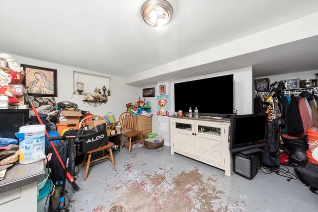 a view of a livingroom with furniture and a flat screen tv