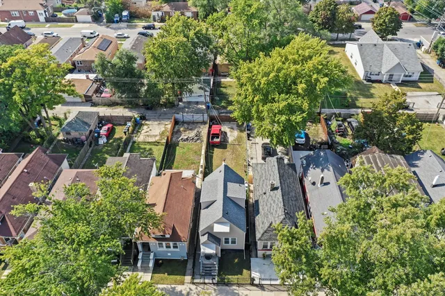 an aerial view of house with yard