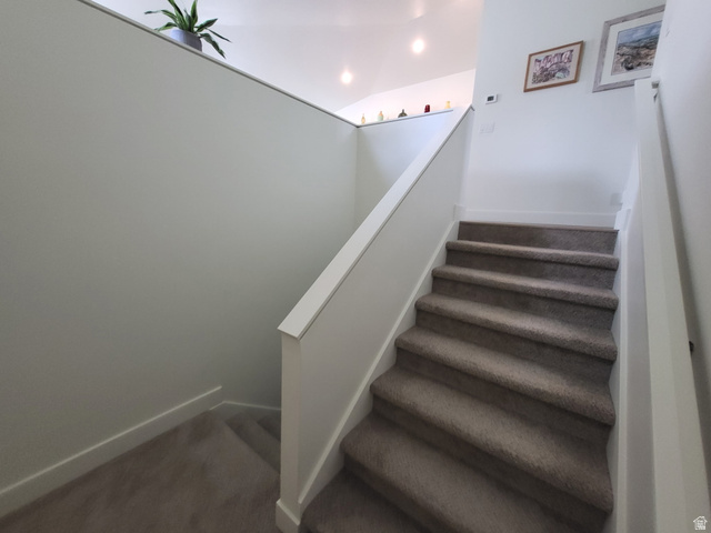 683 Kings Landing Tooele, UT 84074 - Photo 33 of 39 Carpeted staircase featuring a painted handrail and white baseboards