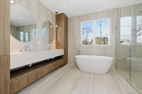 a bathroom with a bathtub and a shower