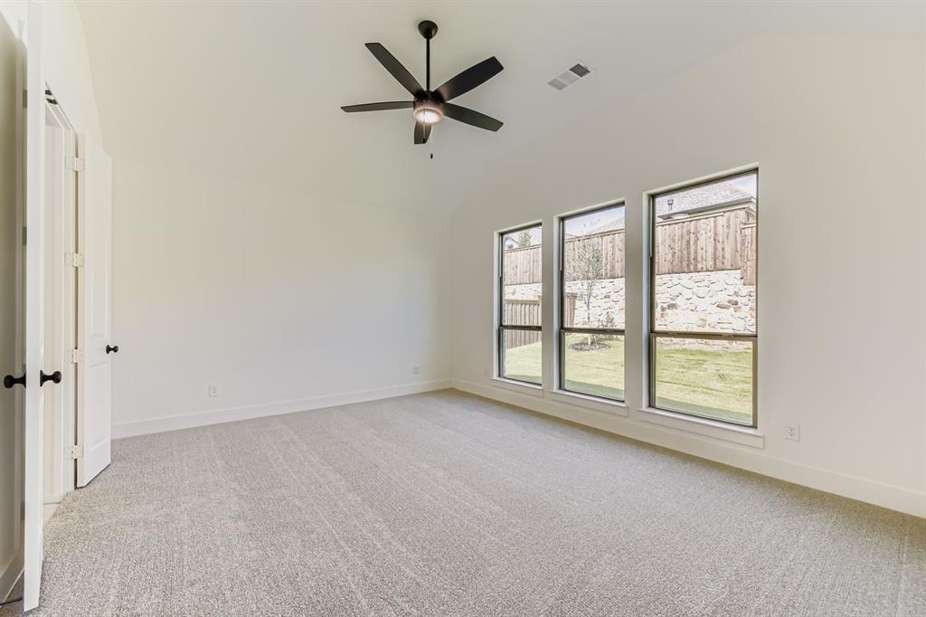 138 Sandie Drive Rhome, TX 76078 - Photo 16 of 28 an empty room with windows and ceiling fan