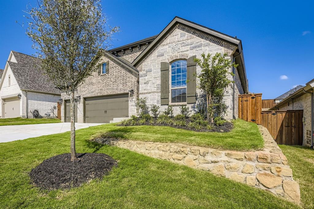 138 Sandie Drive Rhome, TX 76078 - Photo 2 of 28 a front view of a house with a yard