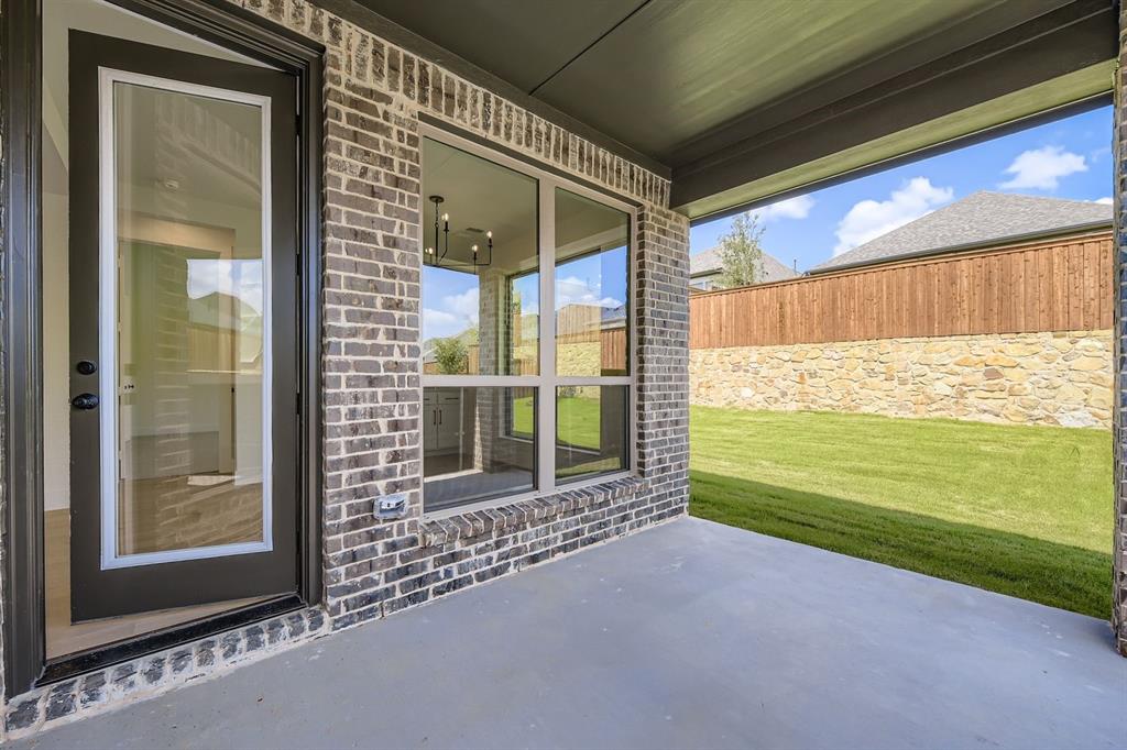 138 Sandie Drive Rhome, TX 76078 - Photo 26 of 28 a view of a room with wooden floor and a porch