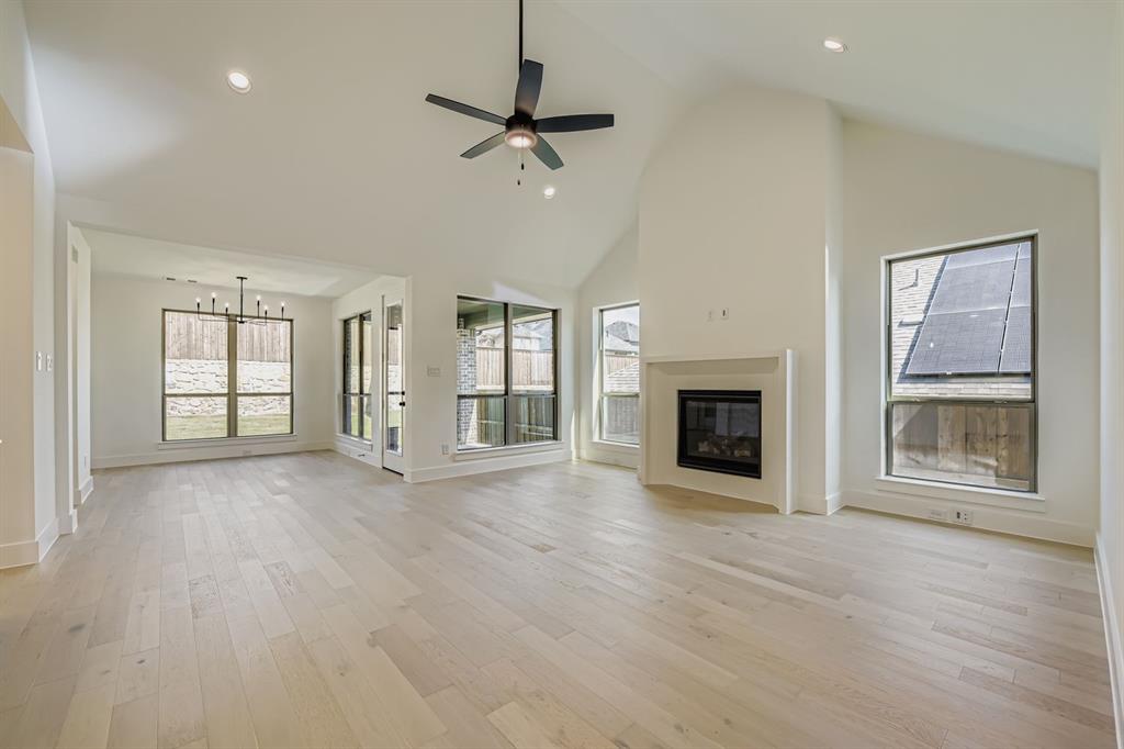 138 Sandie Drive Rhome, TX 76078 - Photo 6 of 28 a view of an empty room with a fireplace and a window