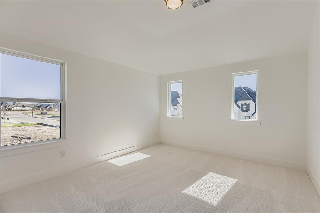 2730 Savannah Ridge Prosper, TX 75078 - Photo 15 of 28 an empty room with windows