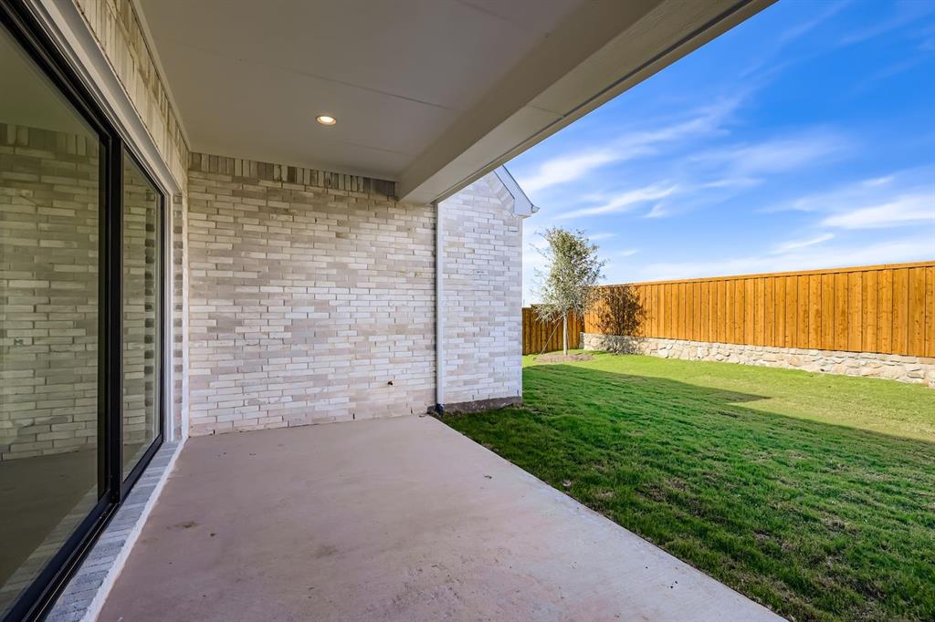 2730 Savannah Ridge Prosper, TX 75078 - Photo 25 of 28 a view of a back yard of the house